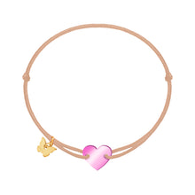 Load image into Gallery viewer, Bracelet with a pink heart charm and gold butterfly logo on a beige cord against a white background by borboleta jewelry brand